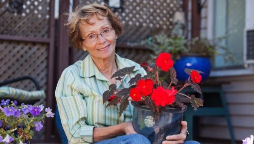 Photo of a woman holding flowers
